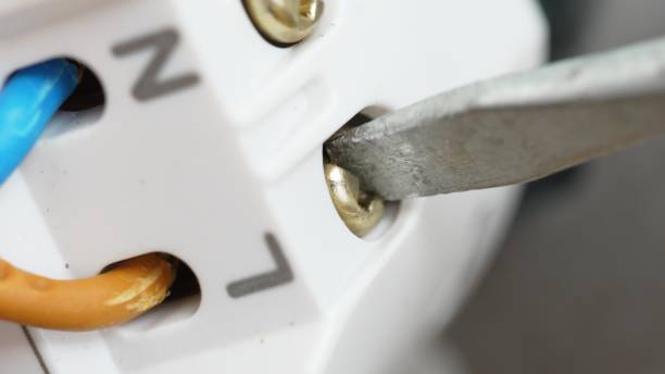 istock Tightening the socket terminals with a screwdriver. 1501450974