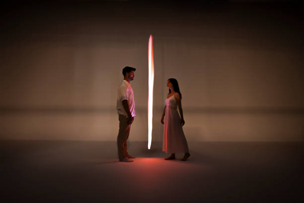 istock Woman and man illuminated by orange light 1501458637