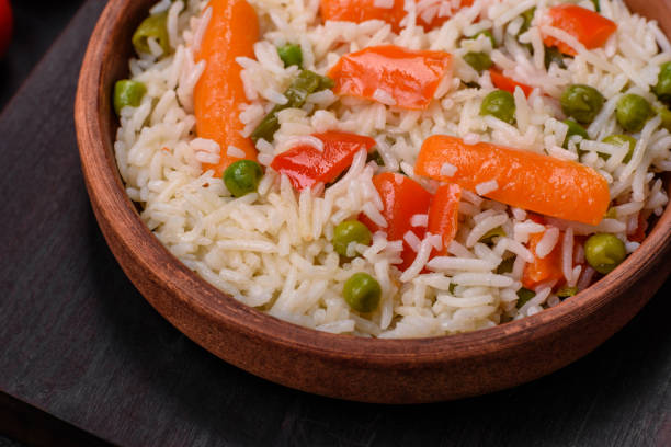 istock Delicious boiled rice with vegetables or risotto with salt, spices and herbs 1501465986