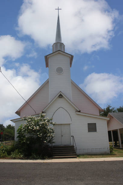 istock Small White Historical Church With Blue Sky on Summer Day 1501475847