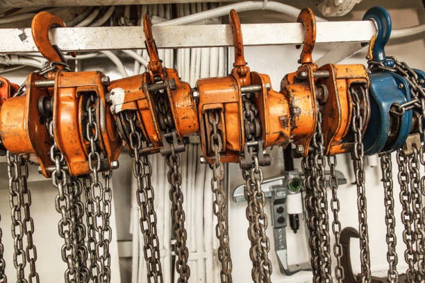 istock Chain hoists for lifting weights in a workshop close-up. 1501479262