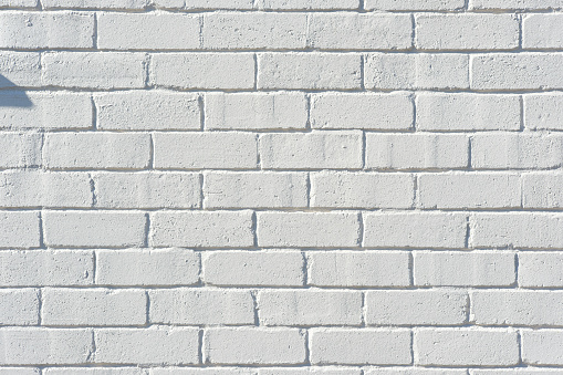 Close-up on an old white brick wall
