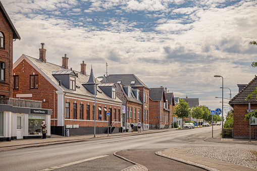 Frederikssund, Denmark - June 15th 2023: Old residential buildings in main street in a Danish provincial tow, Frederikssund which is a remote suburb to Copenhagen