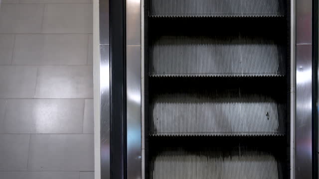 Escalator in a shopping mall without people.
