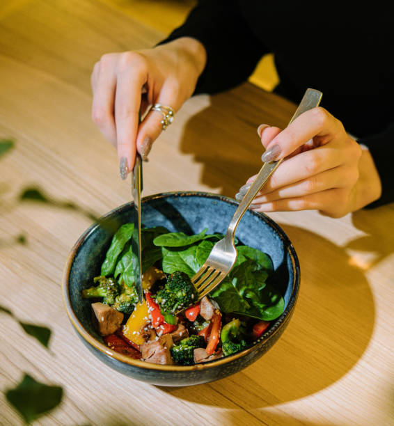 istock girl eats warm salad with meat 1501495062