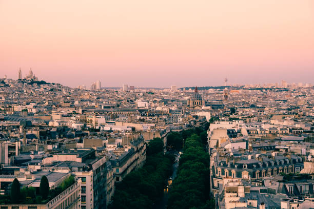 Paris cityscape view Champs-Elysees avenue and Sacre-Coeur sunset stock photo