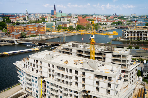 Aerial view of the Odra river with new housing estates under construction, Szczecin, Poland