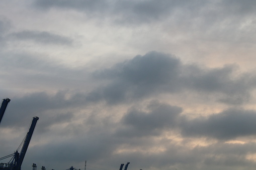 The Cat Lai Seaport in HCMC Connects District 2 and 9 with Dong Nai province to the south which is across the Saigon River. There is a Ferry Service and seaport. Ships use the river to transport goods made in factories in all the provinces around Southern Vietnam. Picture is taken at Sunrise at the Ferry.