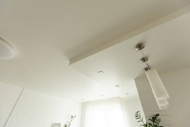 istock Clean gypsum board ceiling in construction site. Under construction a new house with interior modern style. 1501520967