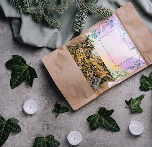 istock Dried and fresh tea leaves with book 1501543836