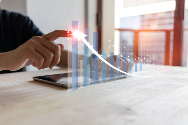 planning and strategy, Stock market, trader or investor working at home. Technical price graph and indicator,  chart and stock trading computer screen on hand. stock photo