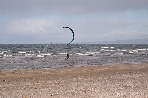 Wind surfing on a Scottish Beach on the West Coast of Scotland on a windy blustery day