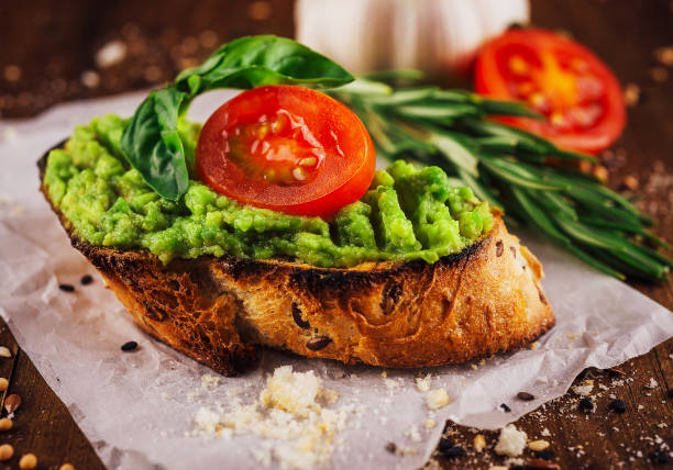 istock Homemade bruschetta with pesto sauce on rustic background 1501577283