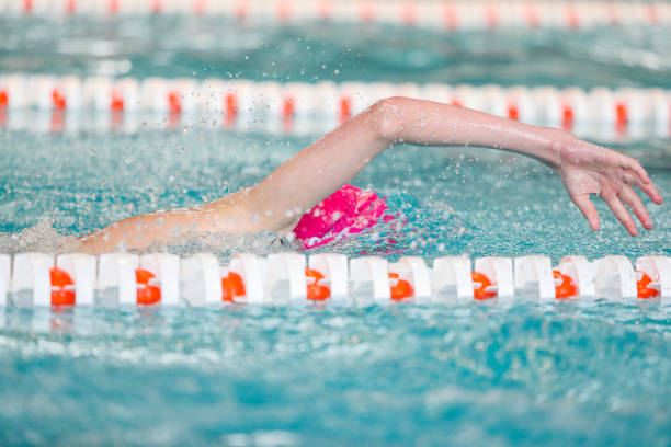 istock Swimmer jumps into the pool 1501582765