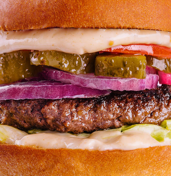 istock Tasty and appetizing hamburger cheeseburger closeup 1501585999