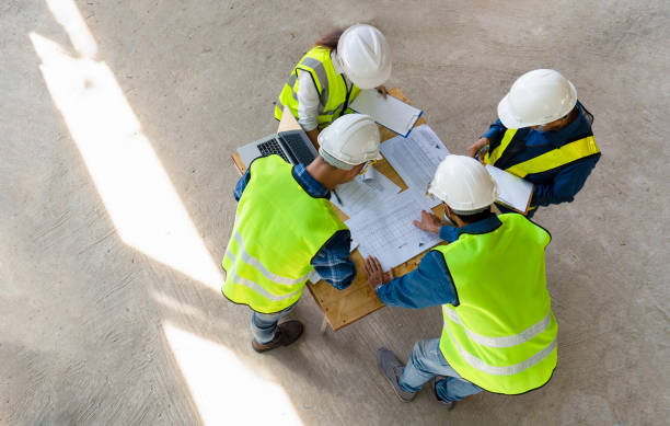 istock team of civil technician engineers discuss the timeline with architect foreman worker while inspecting 1501592343