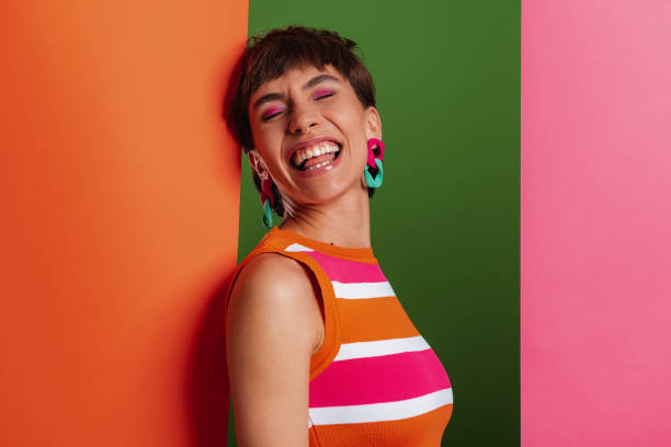 istock Attractive young woman looking excited while standing between colorful banners 1501631074