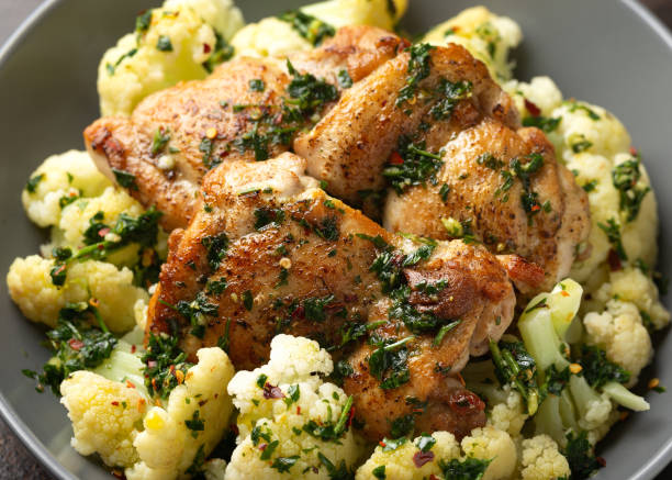 Homemade Chimichurri Chicken thighs with cauliflower. Healthy food