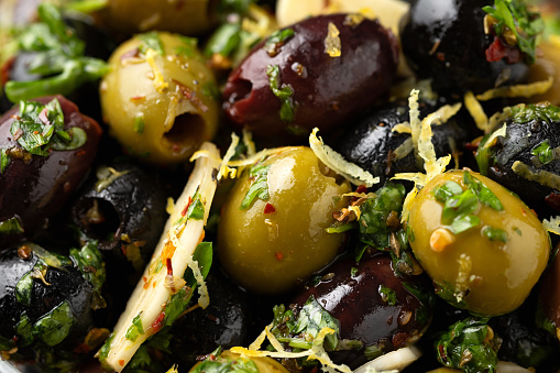 Marinated olives with fresh herbs, garlic, red wine vinegar and lemon zest.
