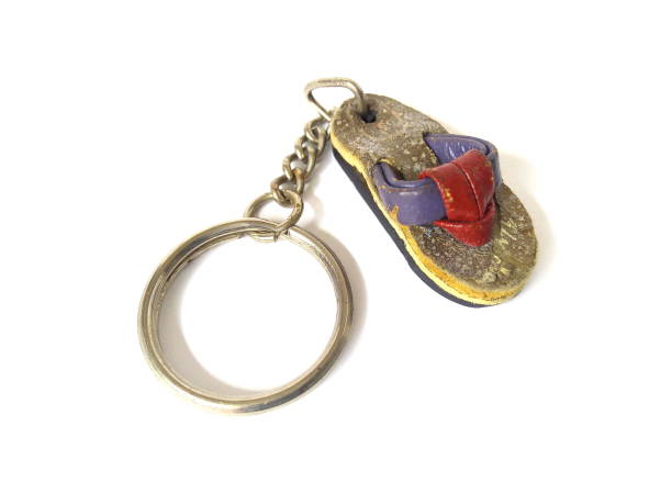 istock Close up of artificial shoe with key chain isolated on white background. 1501650124