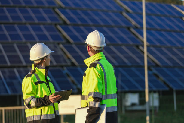 istock Two engineers discussing operation of solar power station 1501660210