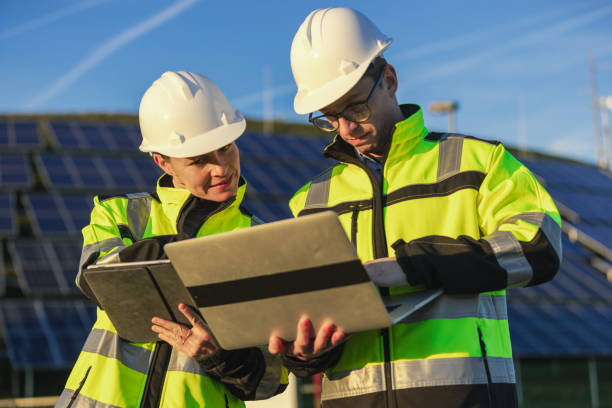 istock Two engineers discussing operation of solar power station 1501660211