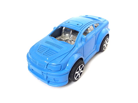 Close up of child toy car isolated on white background.