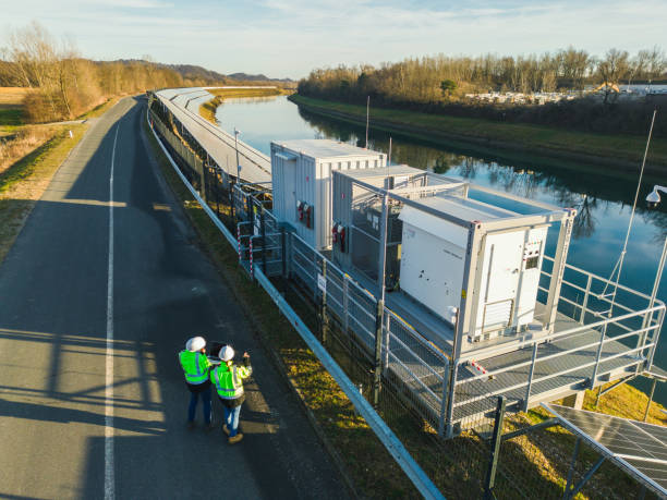 istock AERIAL VIEW  Two engineers examining solar power plant by river 1501673468
