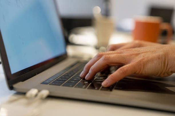 istock Close-up shot of person's hand typing on laptop computer 1501675806
