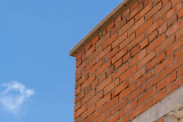istock Red brick stone building on blue sky 1501677147