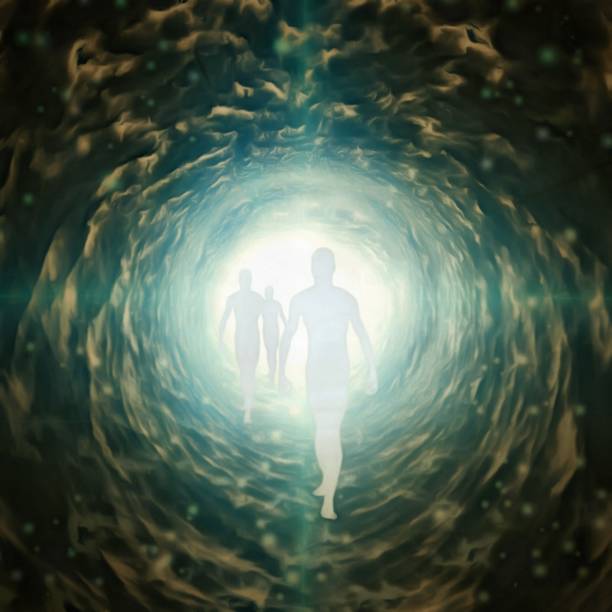 istock Human souls in a tunnel of light 1501677666