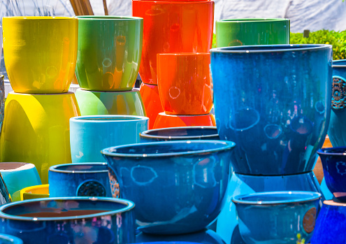 A display of colorful earthenware flower pots at a Cape Cod Garden center