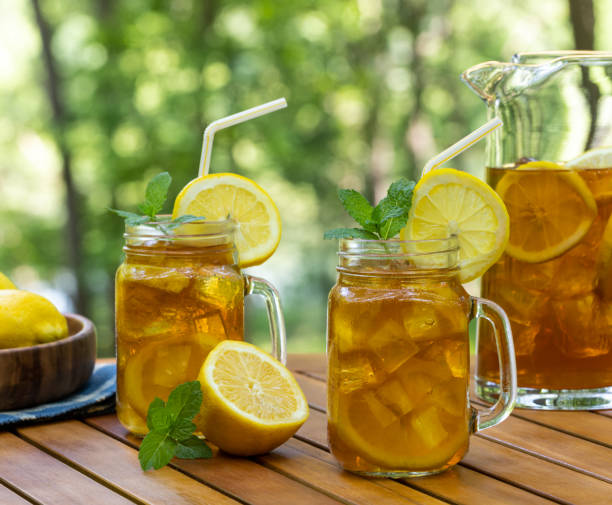 istock Ice tea in glass and pitcher with lemon and mint 1501711581