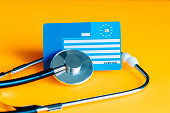 European health insurance card, concept, EU document confirming the right to treatment outside their own country, travel insurance for Europeans traveling to EU and EFTA countries