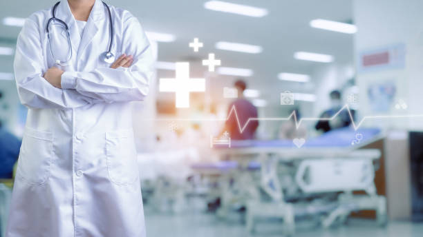 istock Doctor in lab coat and stethoscope Standing with arms crossed on blurred background inside a hospital. Medical icons . Medical concept. Treatment. Medical technology. medical application 1501718648
