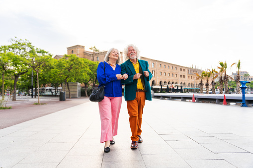 Senior couple having fun strolling in the city.
