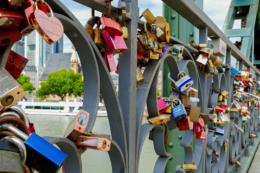 Locks on the fence of the bridge in lisbon as a symbol of eternal love