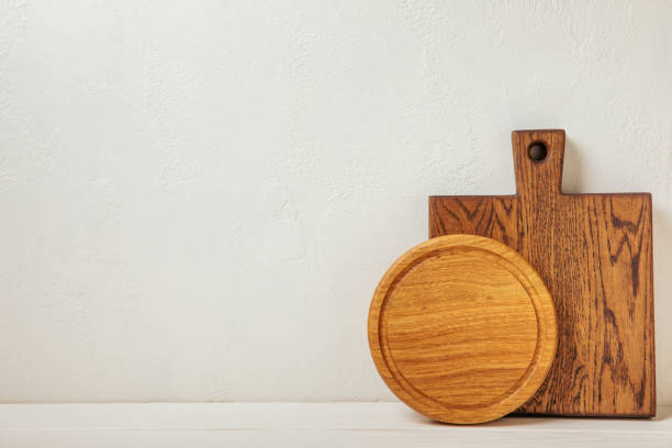 istock Empty wooden board on kitchen white marble table. Cutting board. Wooden cutting board, copy space. Kitchenware. Recipe. Place for text. Flat lay. 1501741099