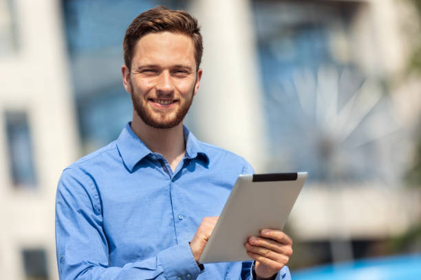 istock Ginger businessman working outdoors on his tablet 1501741935