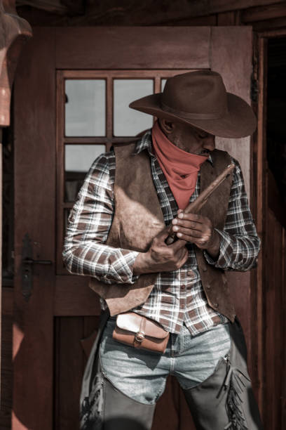 istock Handsome Black Cowboy in an authentic wild west setting 1501746056