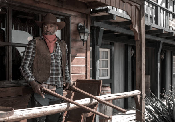 istock Handsome Black Cowboy in an authentic wild west setting 1501746605