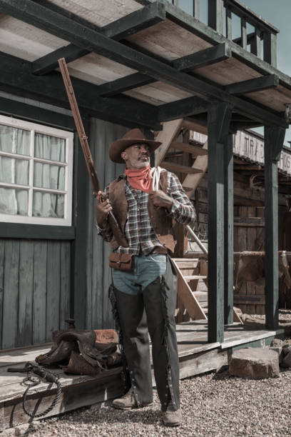 istock Handsome Black Cowboy in an authentic wild west setting 1501747937