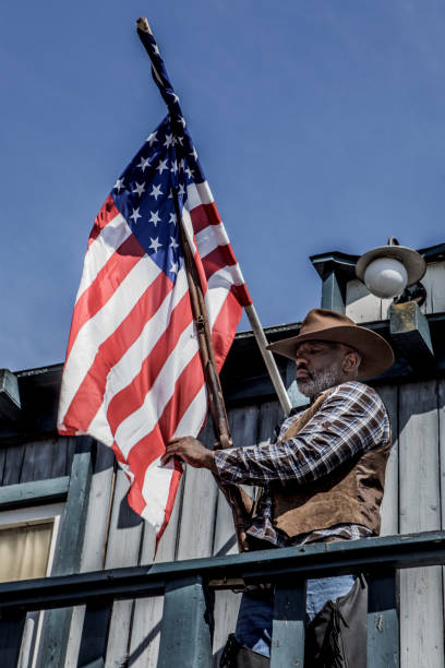 istock Handsome Black Cowboy in an authentic wild west setting 1501749210