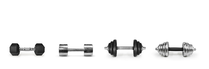 Metal dumbbells on a white background. Gym, fitness and sports equipment symbols. text input area