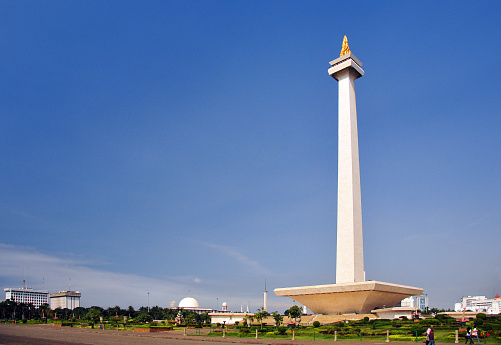 Jakarta, Java, Indonesia: National Monument tower (Monas) in Merdeka Square, commemorates Indonesian independence - at the base if the National History Museum - architects Frederich Silaban and R.M. Soedarsono - the vast square was created in Dutch colonial times as the Koningsplein, i.e. King's Square, it hosts national events such as military parades, as well as civic and political demonstrations -  Monumen Nasional aka Monas