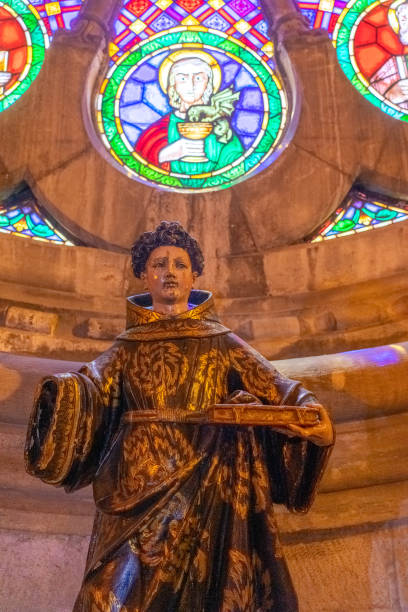 istock statue representing a saint in front of the Gothic rose window inside the Lisbon Cathedral 1501752017