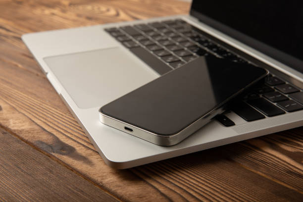 istock Open laptop with digital tablet and smartphone on the office table. Office workplace with text space. top view, flatley. MOCAP. Technology concept. 1501752759