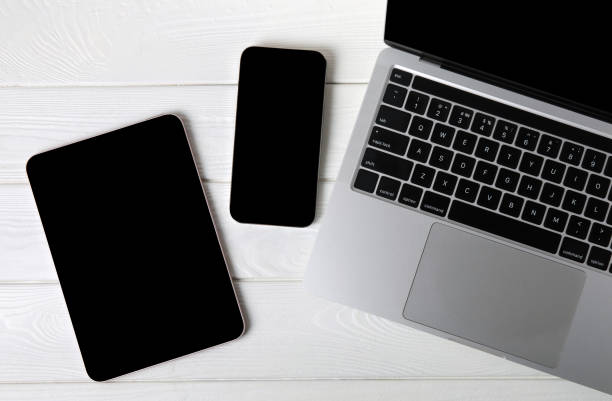 istock Open laptop with digital tablet and smartphone on the office table. Office workplace with text space. top view, flatley. MOCAP. Technology concept. 1501752780