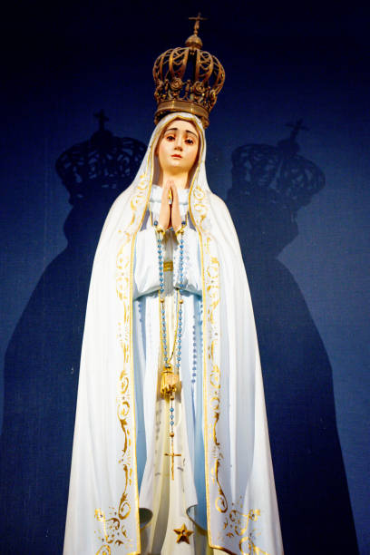 istock Virgin Mary statue with black background 1501752932