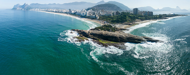 Aerial view of Rio de Janeiro, Ipanema beach and Pedra do Arpoador. Skyscrapers beaches and nature, surfers in the water. 06-07-2023. Brazil